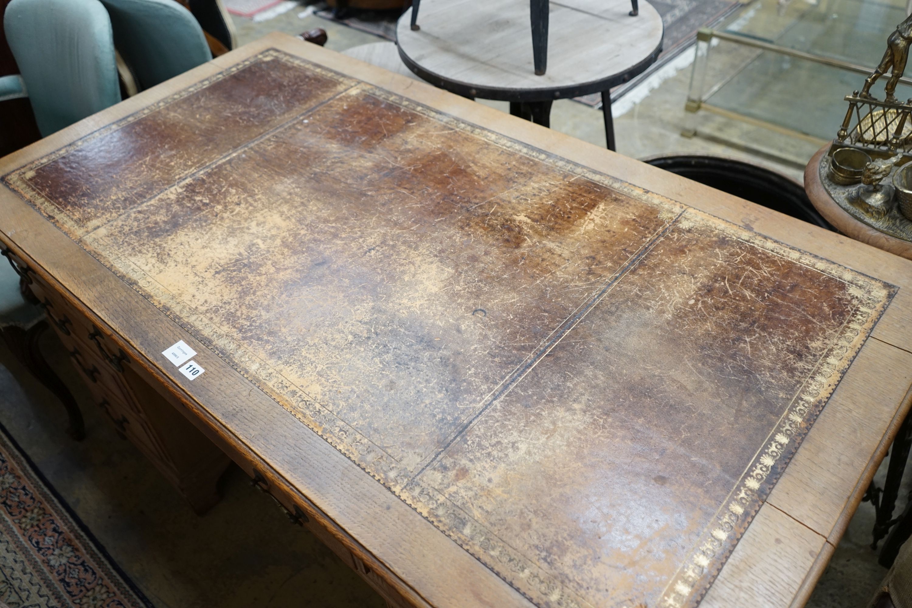 An early 20th century faded oak pedestal desk, length 153cm, depth 80cm, height 77cm